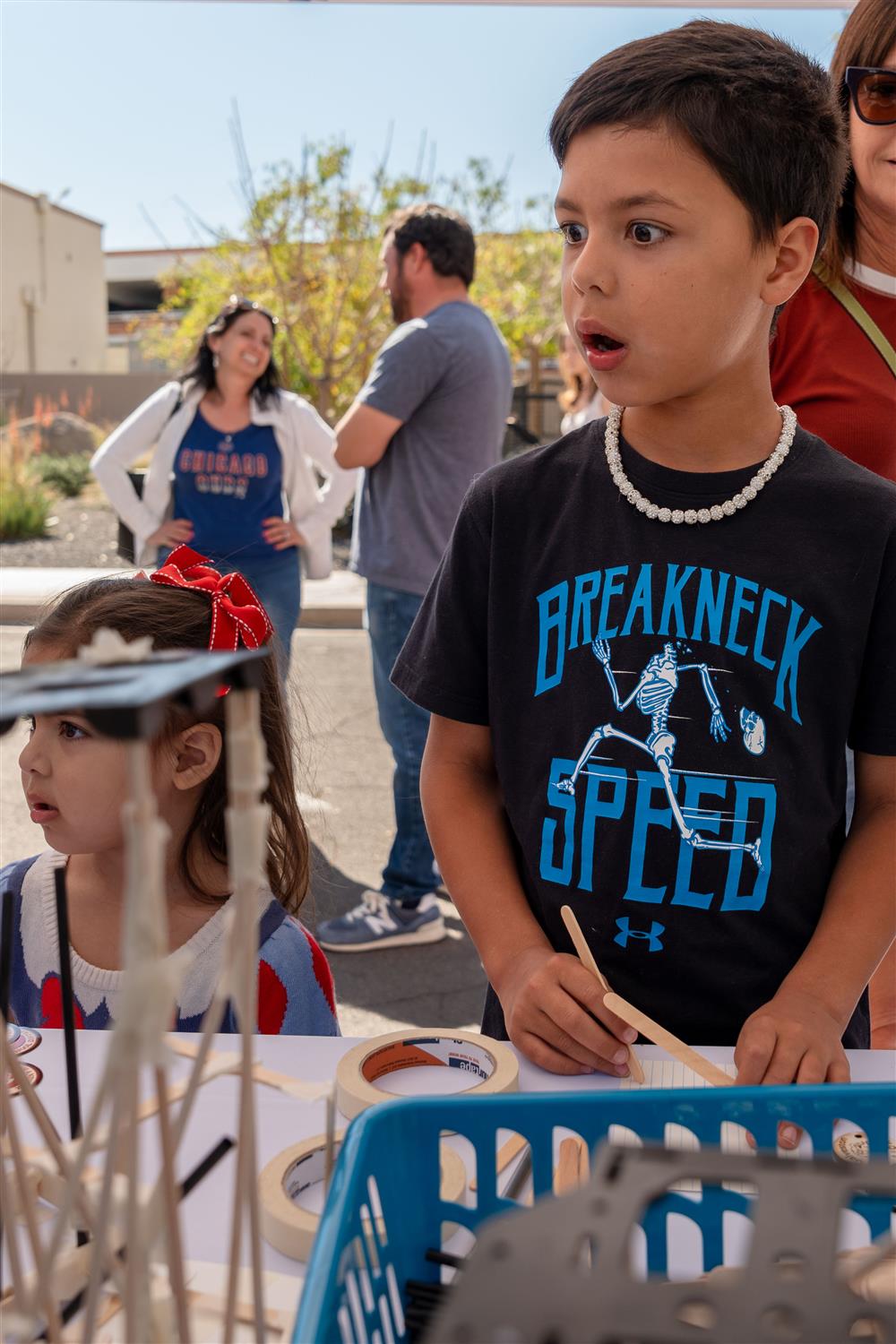 A child looks at something off camera in surprise and awe.